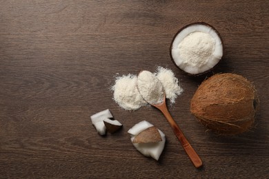 Photo of Coconut flour and fresh fruits on wooden table, flat lay. Space for text