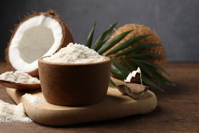 Photo of Organic coconut flour, fresh fruits and leaf on wooden table