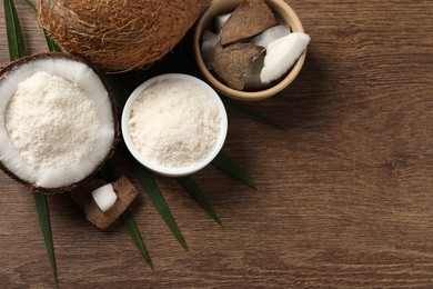 Photo of Coconut flour and fresh fruits on wooden table, flat lay. Space for text