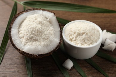 Photo of Coconut flour and leaf on wooden table, closeup