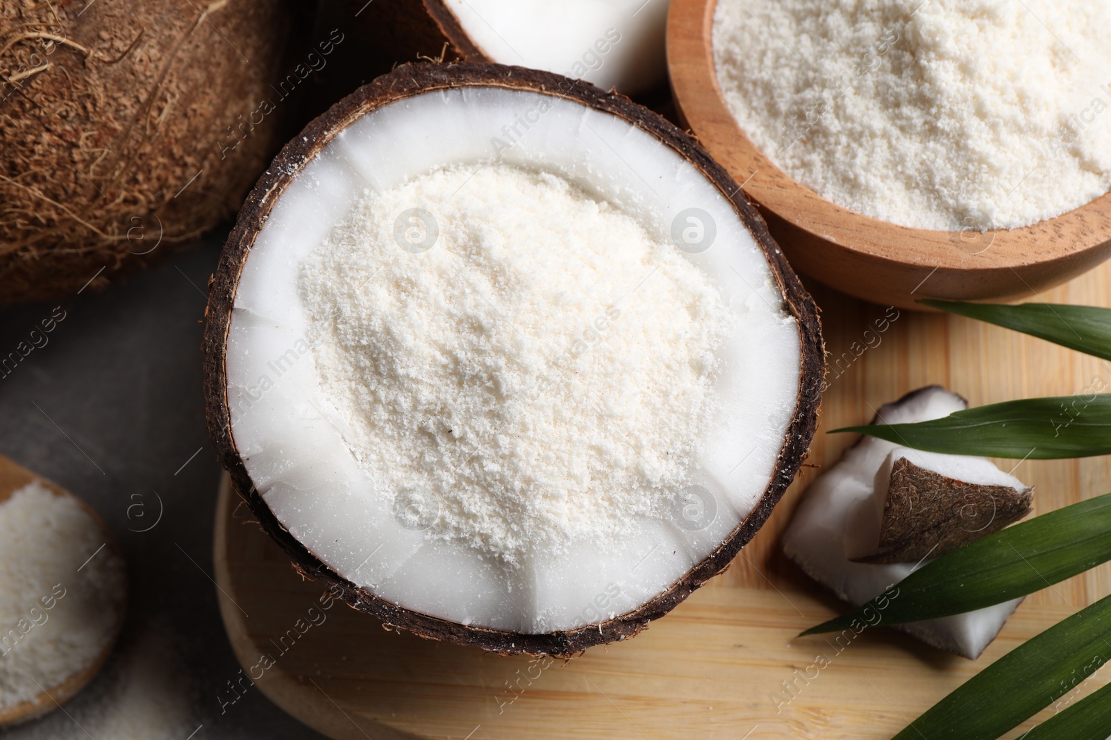 Photo of Coconut flour and fresh fruits on table, flat lay