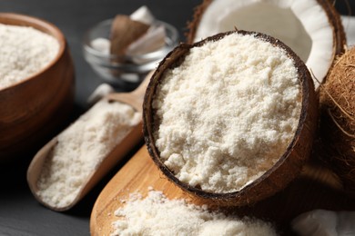 Photo of Organic coconut flour and fresh fruits on table, closeup