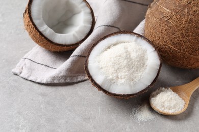 Photo of Organic coconut flour and fresh fruits on light grey table