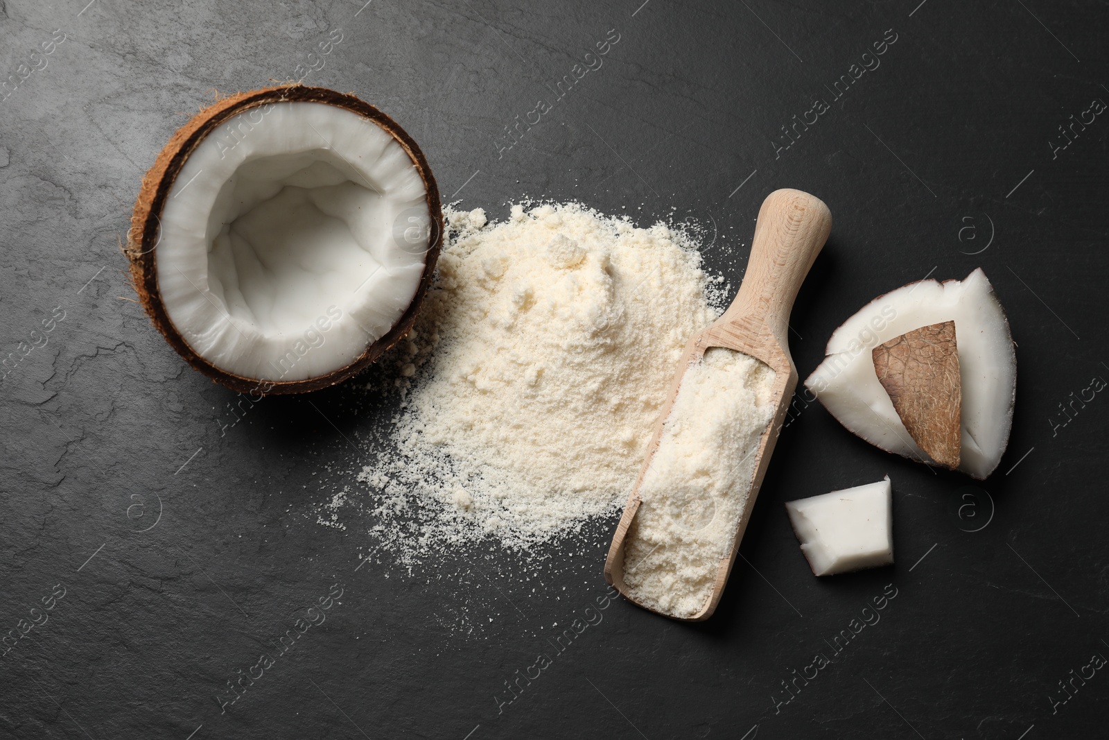 Photo of Organic coconut flour and fresh fruits on black table, flat lay