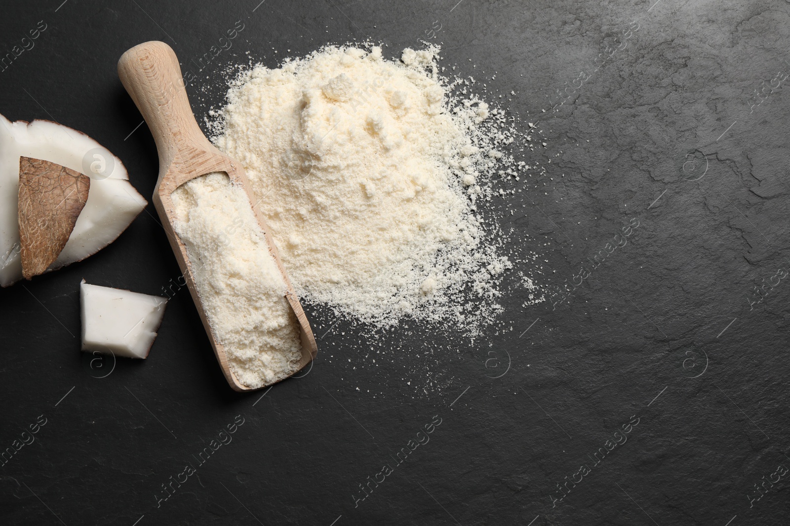 Photo of Organic coconut flour and fresh fruits on black table, flat lay. Space for text