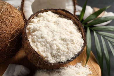 Photo of Coconut flour and fresh fruits on table, closeup