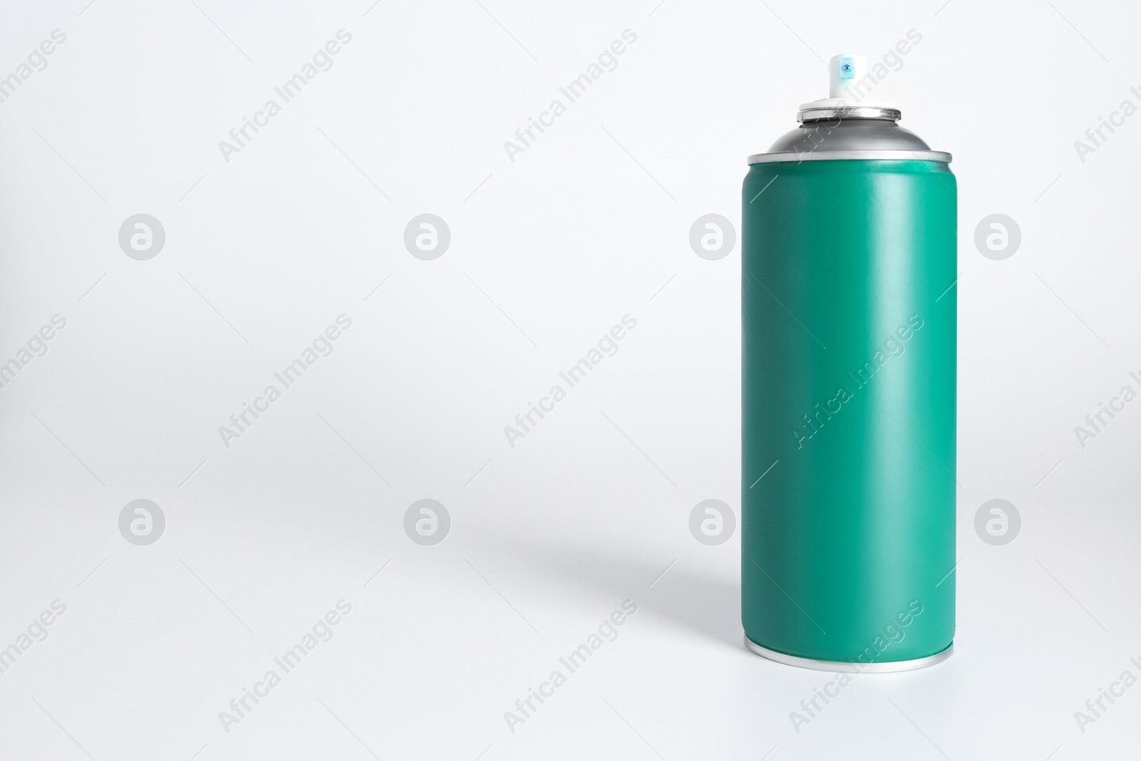 Photo of Can of spray paint on white background, space for text