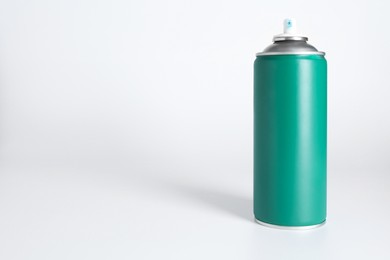 Photo of Can of spray paint on white background, space for text