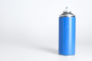 Photo of Can of spray paint on white background, space for text