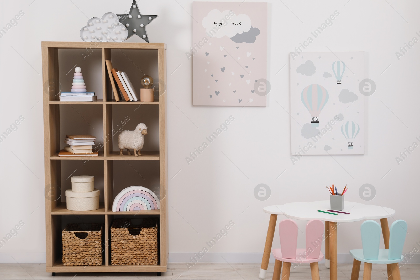 Photo of Child's room interior with modern furniture and beautiful pictures on wall