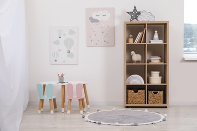 Child's room interior with modern furniture and beautiful pictures on wall