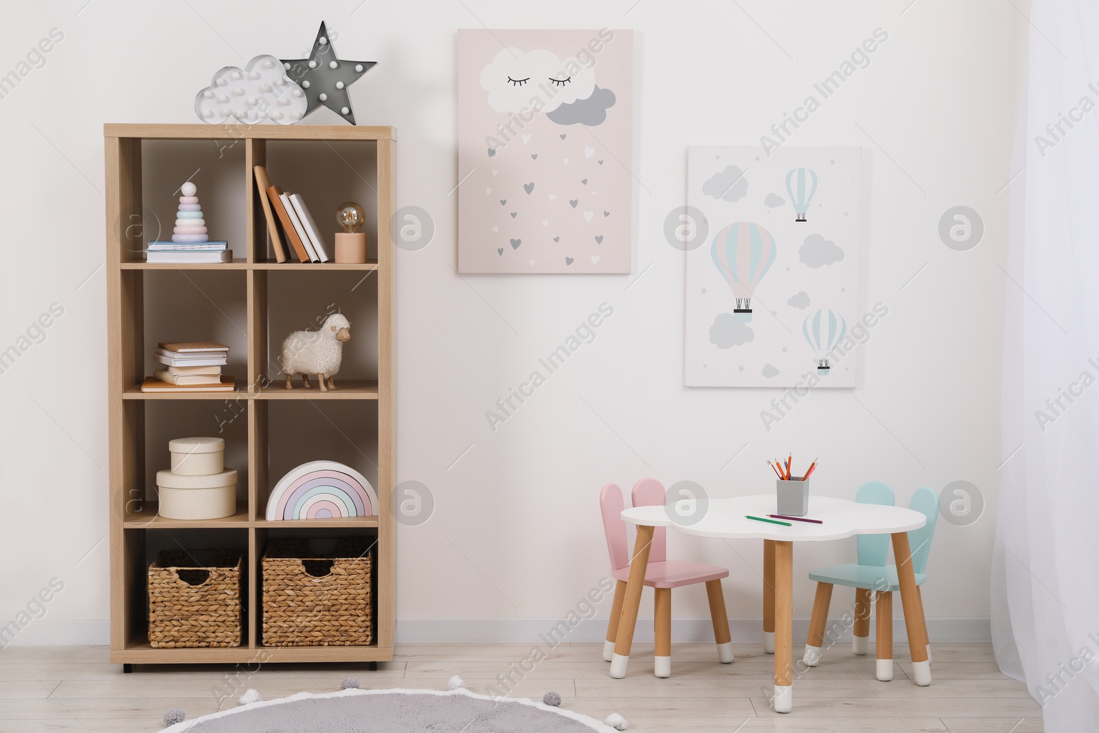 Photo of Child's room interior with modern furniture and beautiful pictures on wall