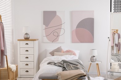 Photo of Teen's room interior with modern furniture and beautiful pictures on wall