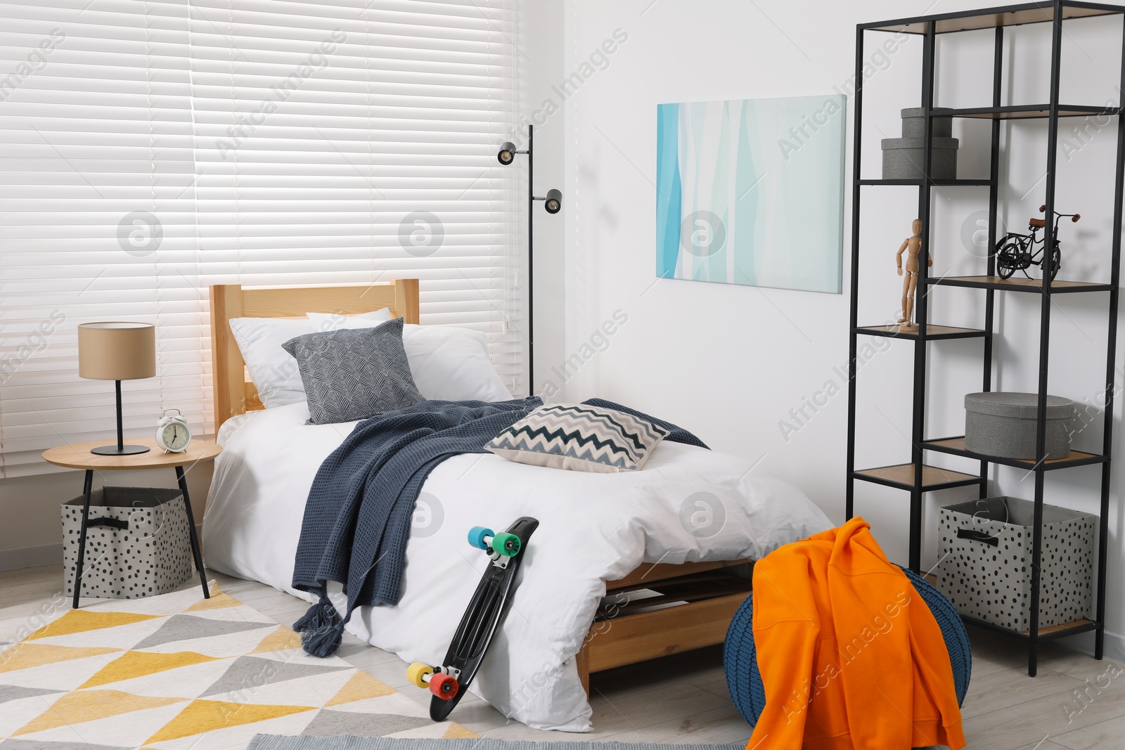 Photo of Teen's room interior with modern furniture and beautiful picture on wall