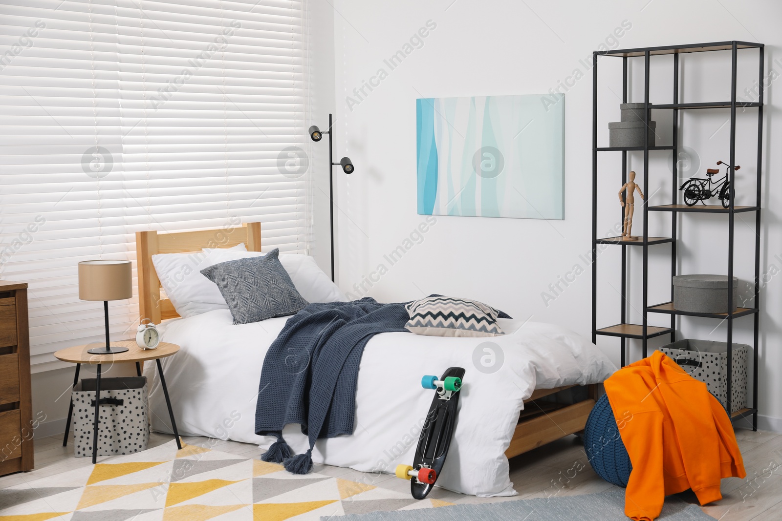 Photo of Teen's room interior with modern furniture and beautiful picture on wall