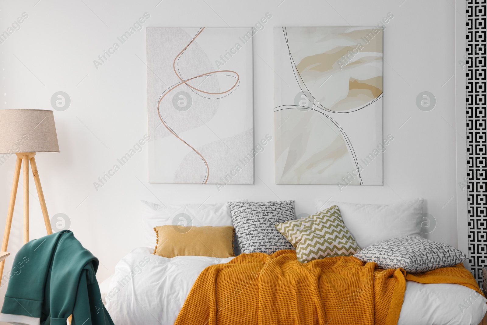 Photo of Teen's room interior with modern furniture and beautiful pictures on wall