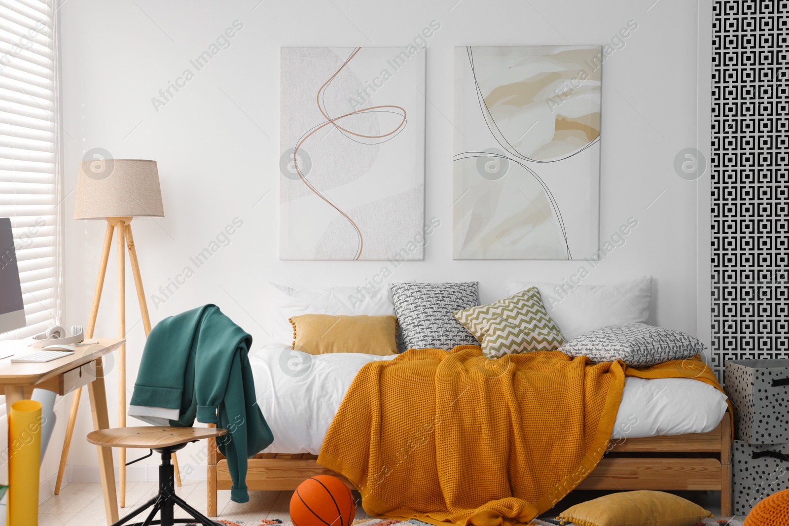 Photo of Teen's room interior with modern furniture and beautiful pictures on wall