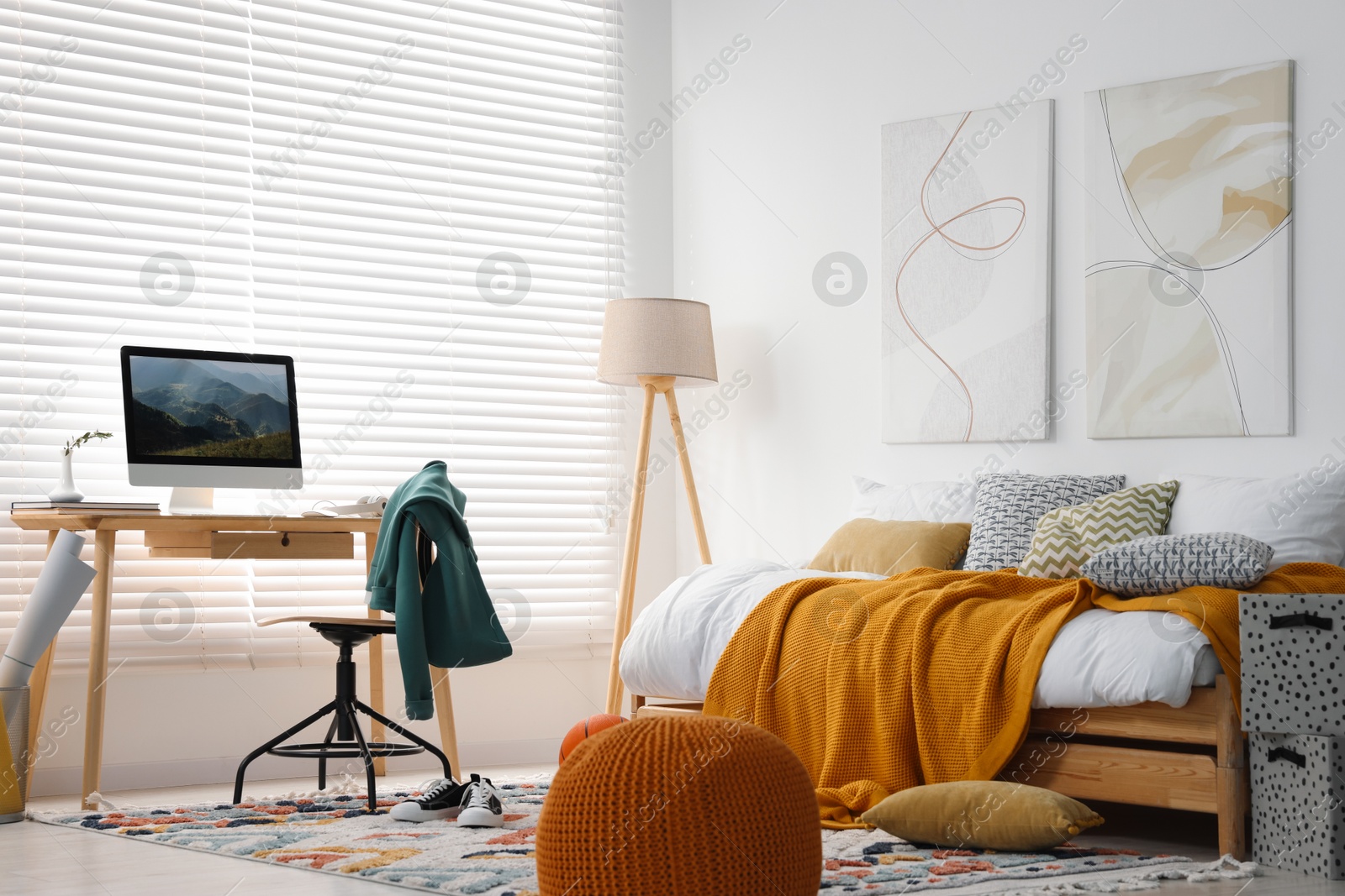 Photo of Teen's room interior with modern furniture and beautiful pictures on wall