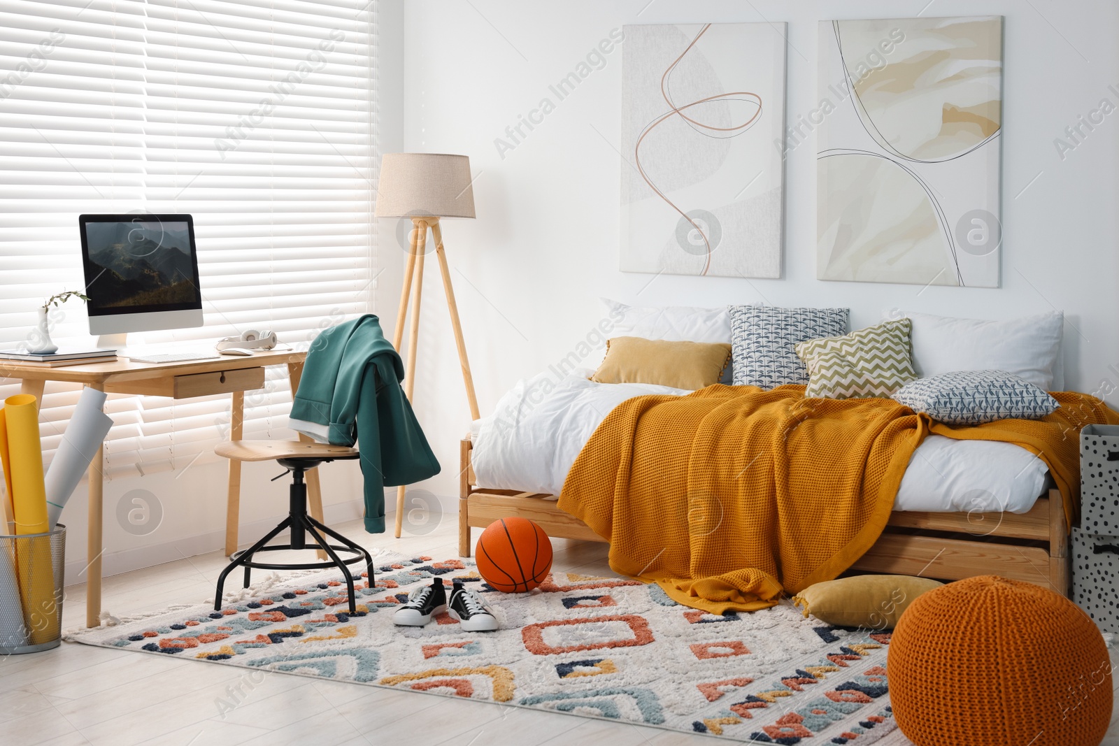 Photo of Teen's room interior with modern furniture and beautiful pictures on wall