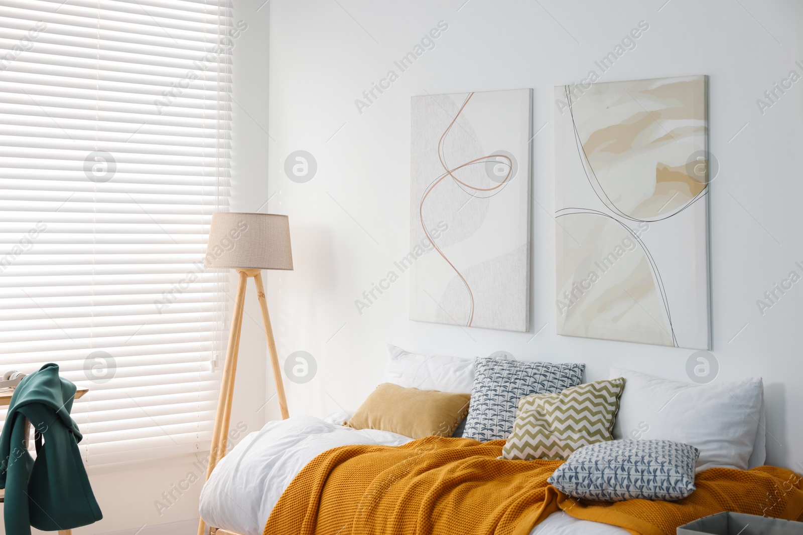 Photo of Teen's room interior with modern furniture and beautiful pictures on wall