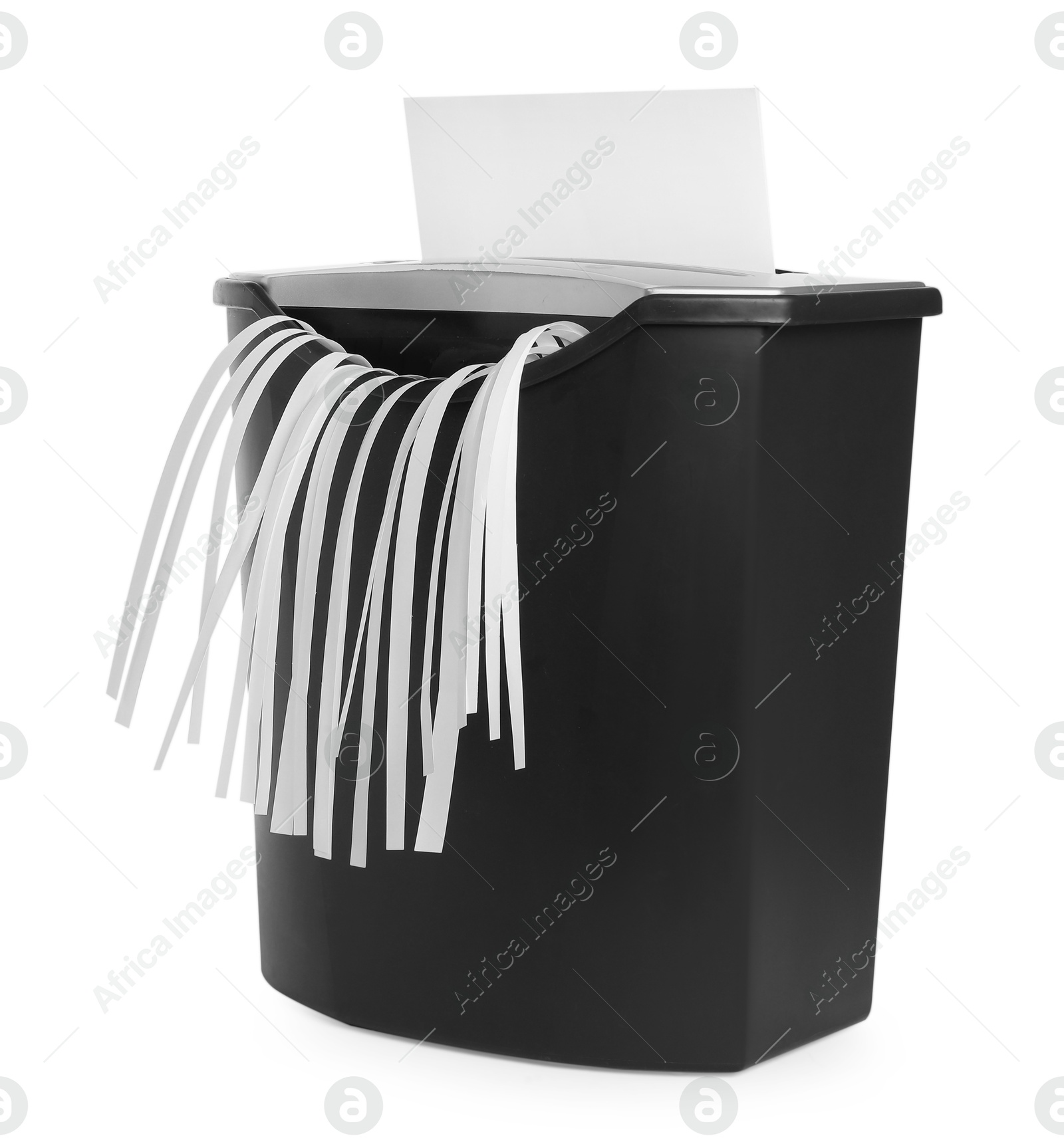 Photo of Destroying sheet of paper with shredder on white background