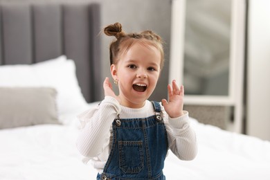 Photo of Portrait of emotional little girl indoors. Cute child