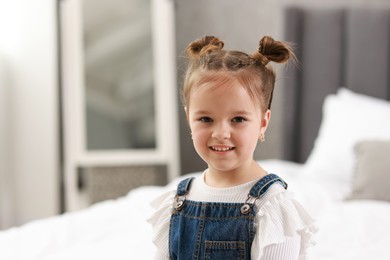 Portrait of happy little girl indoors. Cute child