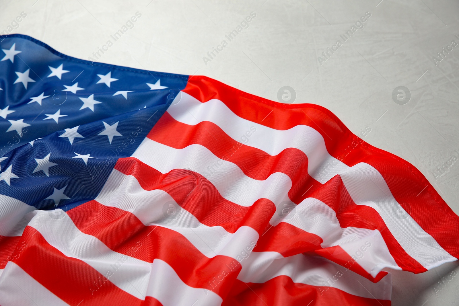 Photo of Flag of USA on white table, closeup