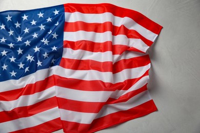 Flag of USA on white table, top view