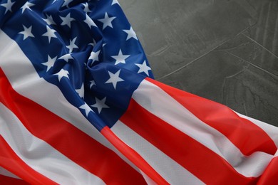 Photo of Flag of USA on black table, closeup. Space for text