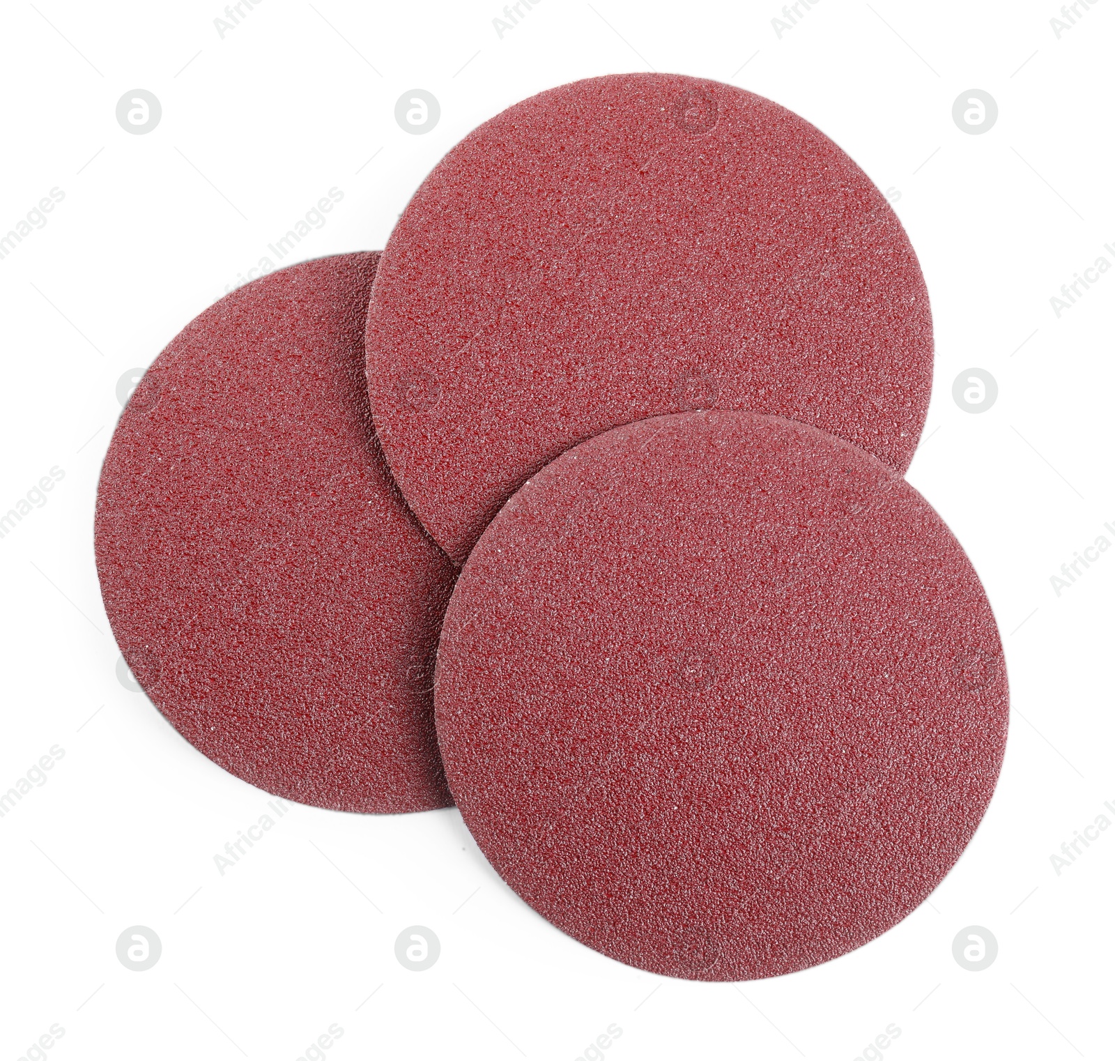 Photo of Coarse sandpaper disks isolated on white, top view