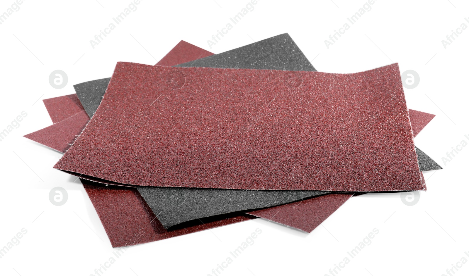 Photo of Many sheets of sandpaper isolated on white