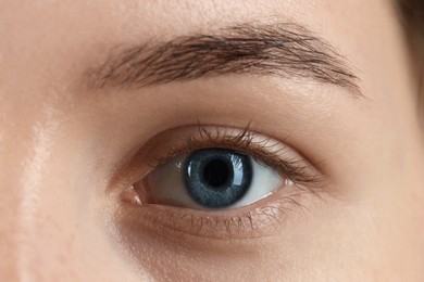 Photo of Woman with beautiful blue eyes, macro photo