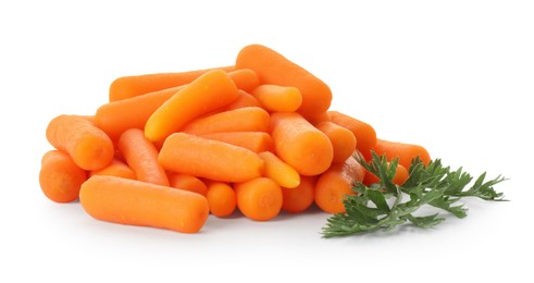 Baby carrots and green leaf isolated on white