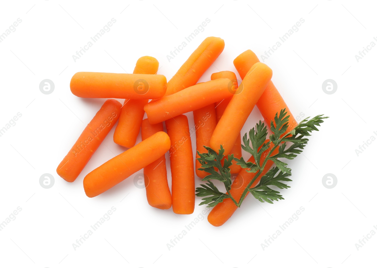 Photo of Many baby carrots and green leaf isolated on white, top view