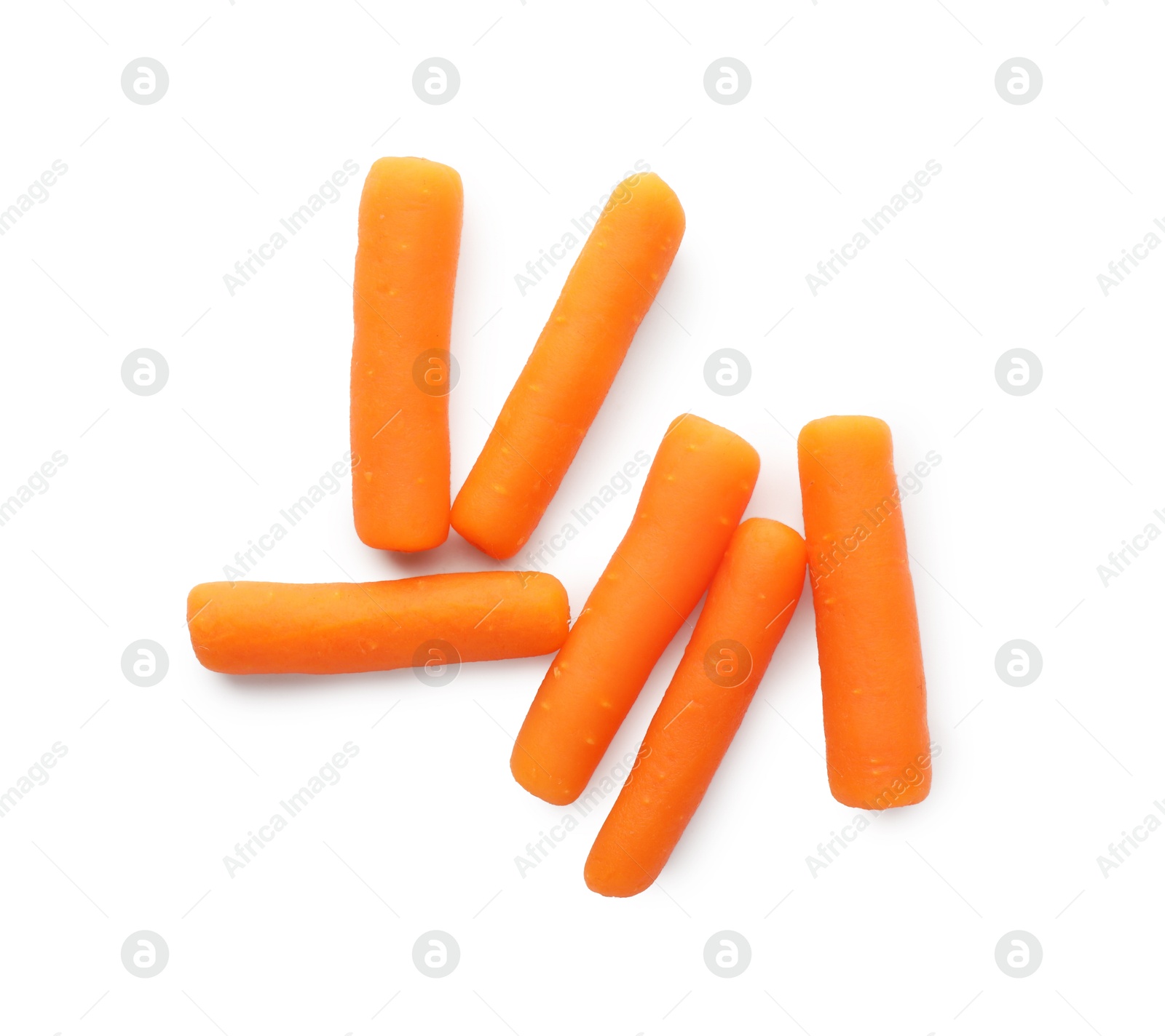 Photo of Many baby carrots isolated on white, top view