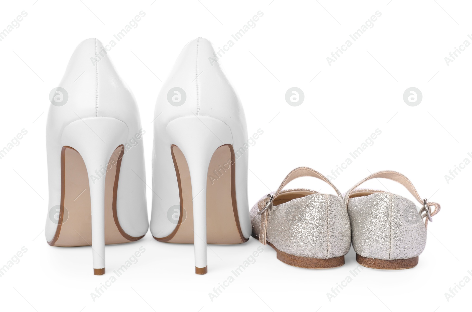 Photo of Big and small shoes isolated on white