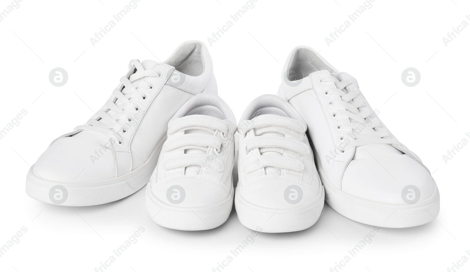 Photo of Big and small sneakers isolated on white