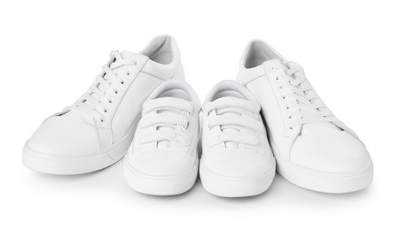 Big and small sneakers isolated on white