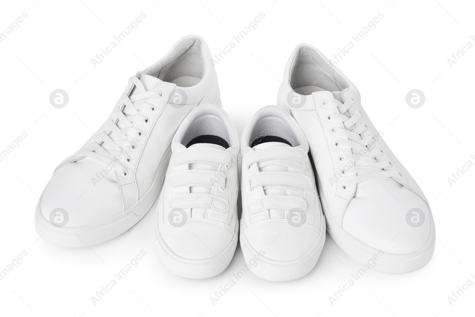 Photo of Big and small sneakers isolated on white