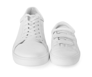 Photo of Big and small sneakers isolated on white