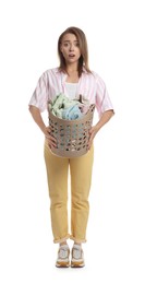 Photo of Tired housewife with basket full of laundry on white background