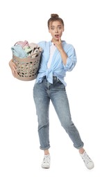 Emotional housewife with basket full of laundry on white background