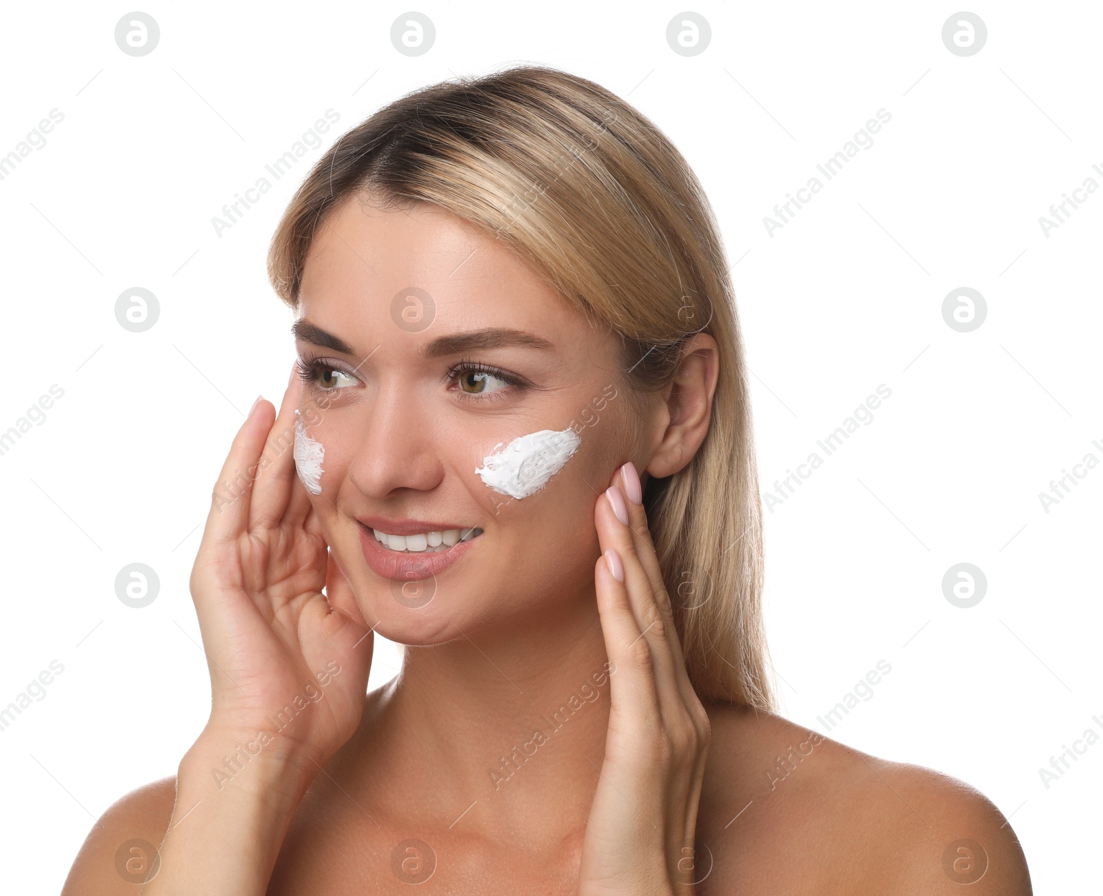 Photo of Beautiful woman with cream on her face against white background