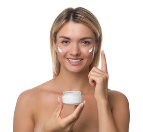 Beautiful woman applying face cream on white background