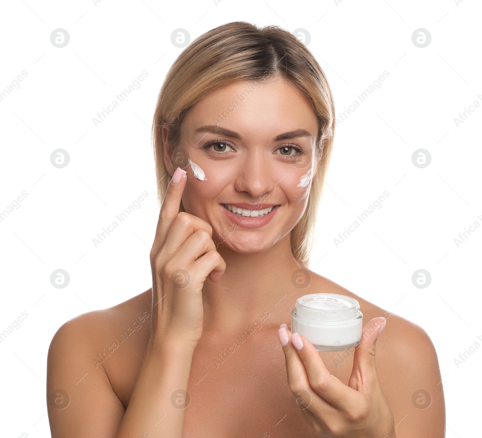 Photo of Beautiful woman applying face cream on white background