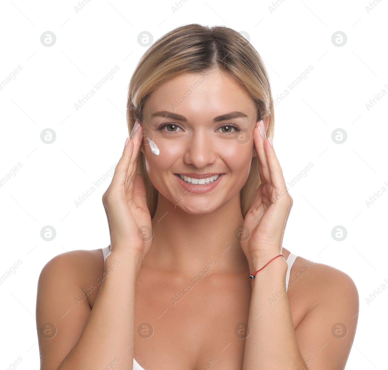 Photo of Beautiful woman with cream on her face against white background