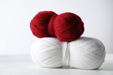 Photo of Two soft skeins of yarn on light grey background