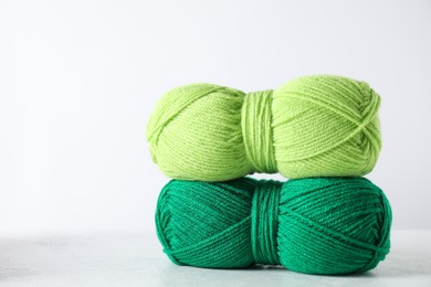 Photo of Two soft skeins of yarn on light grey background