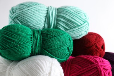 Photo of Many soft skeins of yarn on light grey background